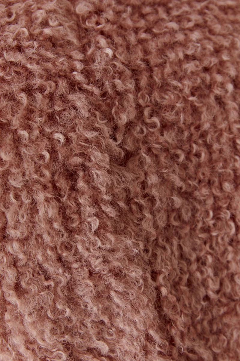 Veste courte sans manches à texture bouclée
