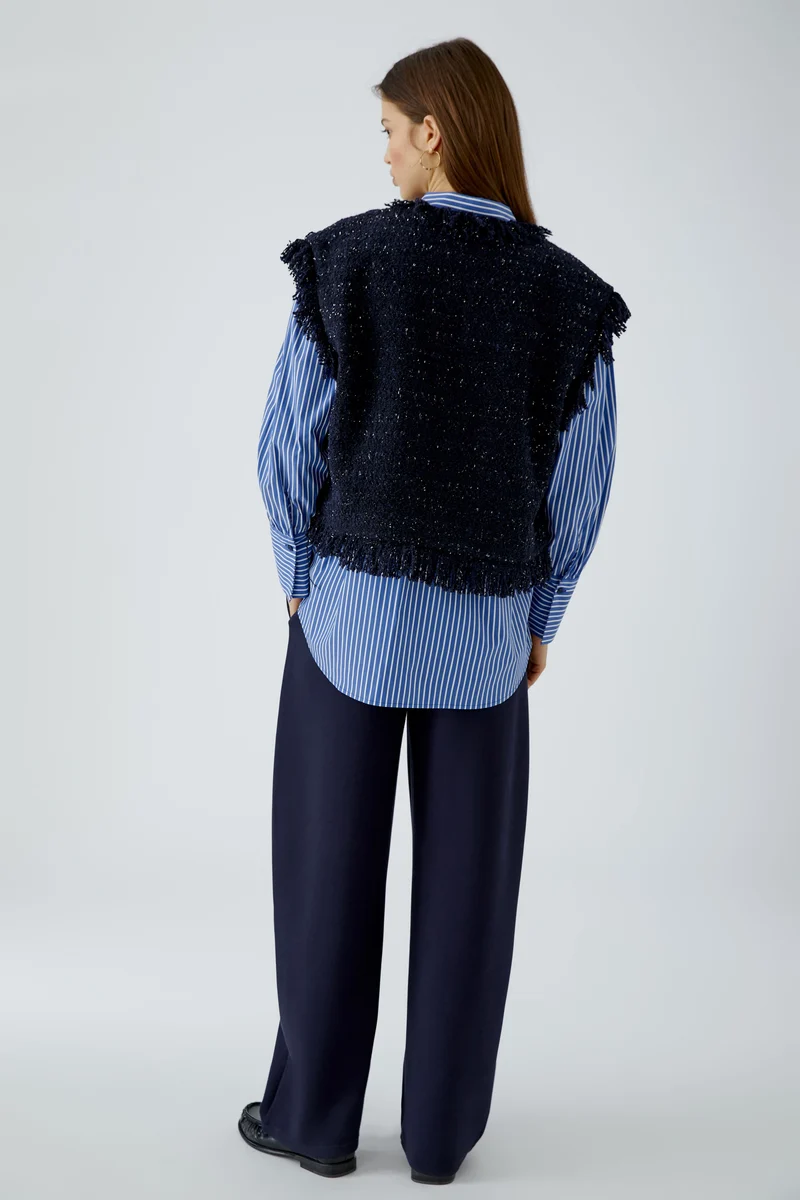 Gilet court en tweed bouclé à franges