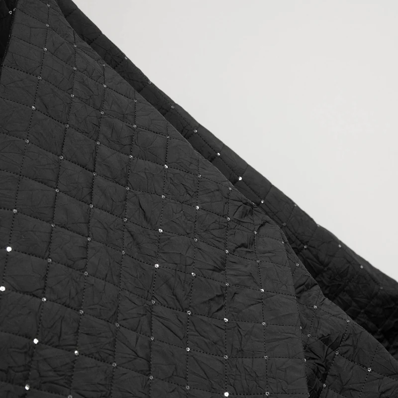 Tissu matelassé en polyester avec paillettes | Noir | Deadstock de designer