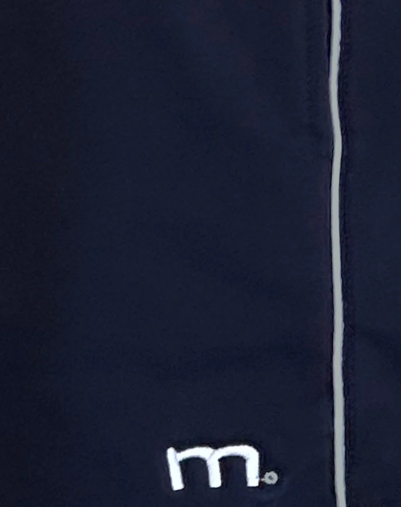 Short Thera en bleu marine avec passepoil blanc et emblème M
