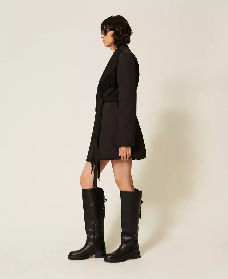 Manteau matelassé ceinturé à franges