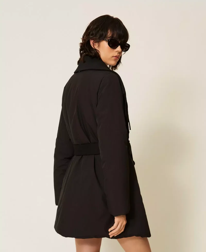 Manteau matelassé ceinturé à franges