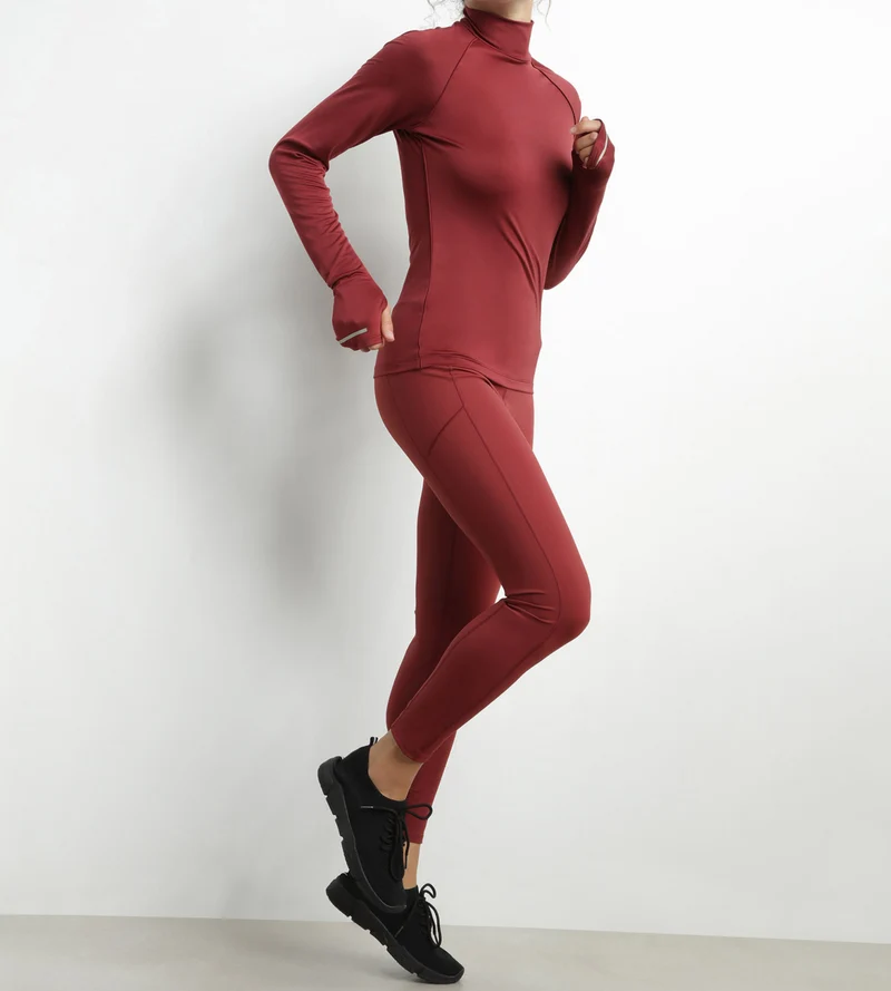 Haut de sport femme à col montant en microfibre Bordeaux Dim Move