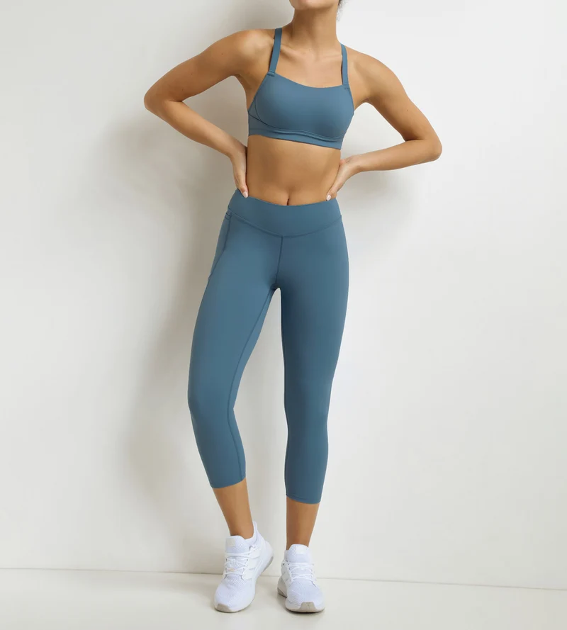 Legging de sport femme court en microfibre Bleu Jean Dim Move