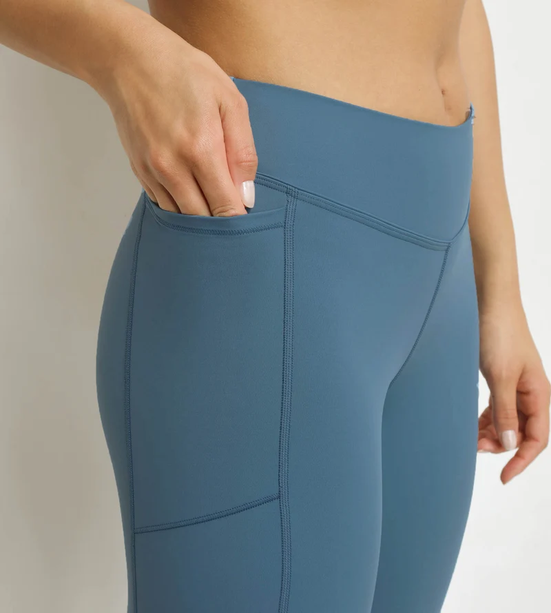 Legging de sport femme court en microfibre Bleu Jean Dim Move