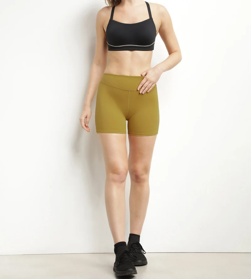 Shorty de sport femme en microfibre sculptante vert olive Dim Move