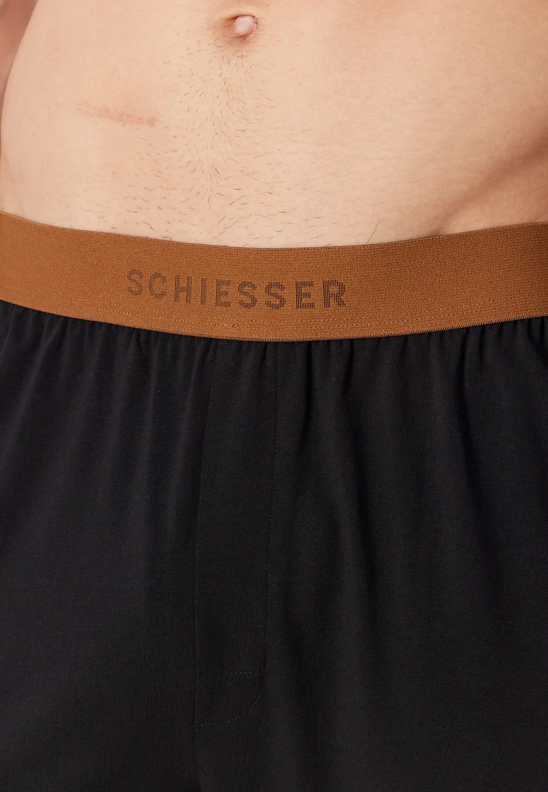 Schlafanzug Orange/Schwarz gemustert - 95/5
