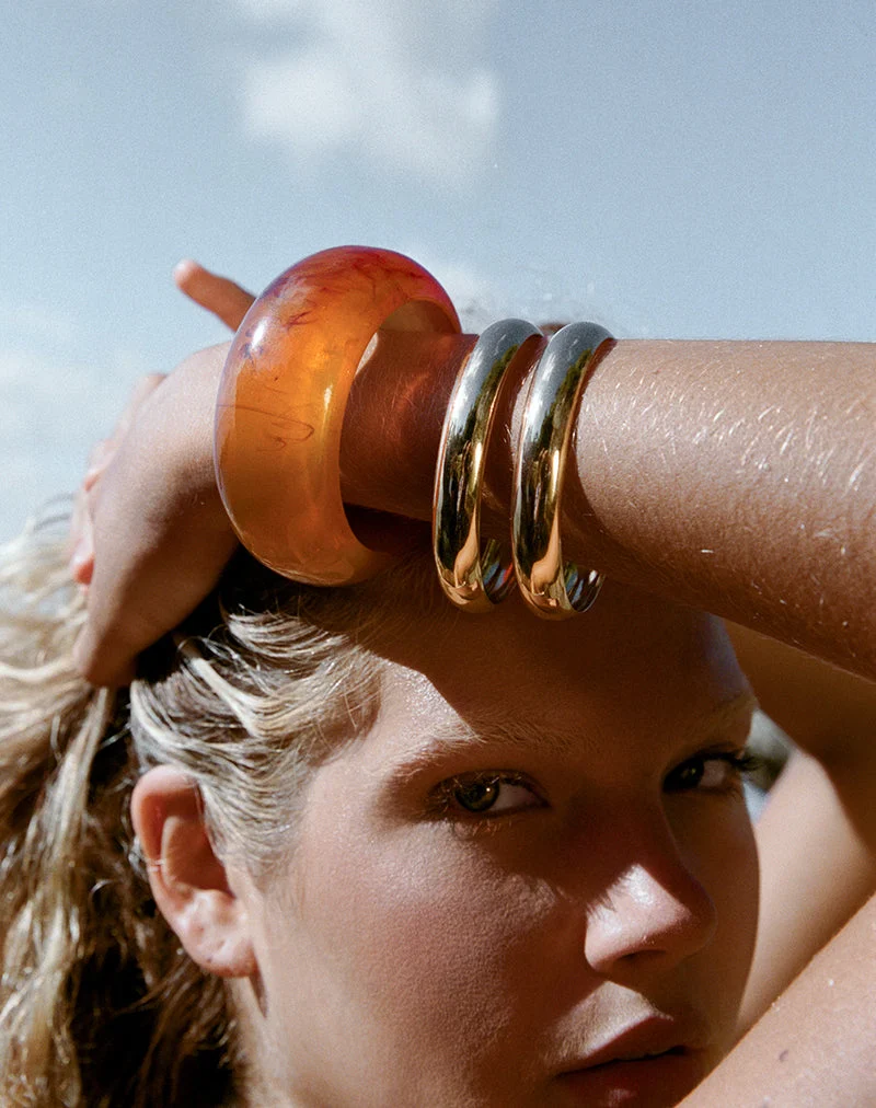 Parure de bracelets orange et dorés