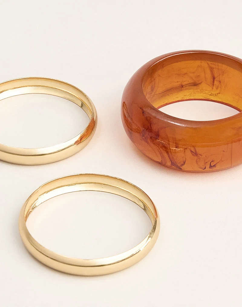 Parure de bracelets orange et dorés