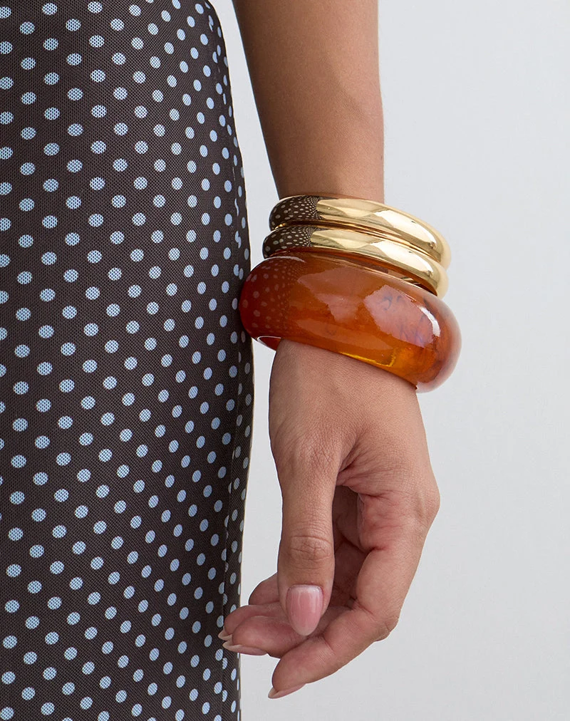 Parure de bracelets orange et dorés