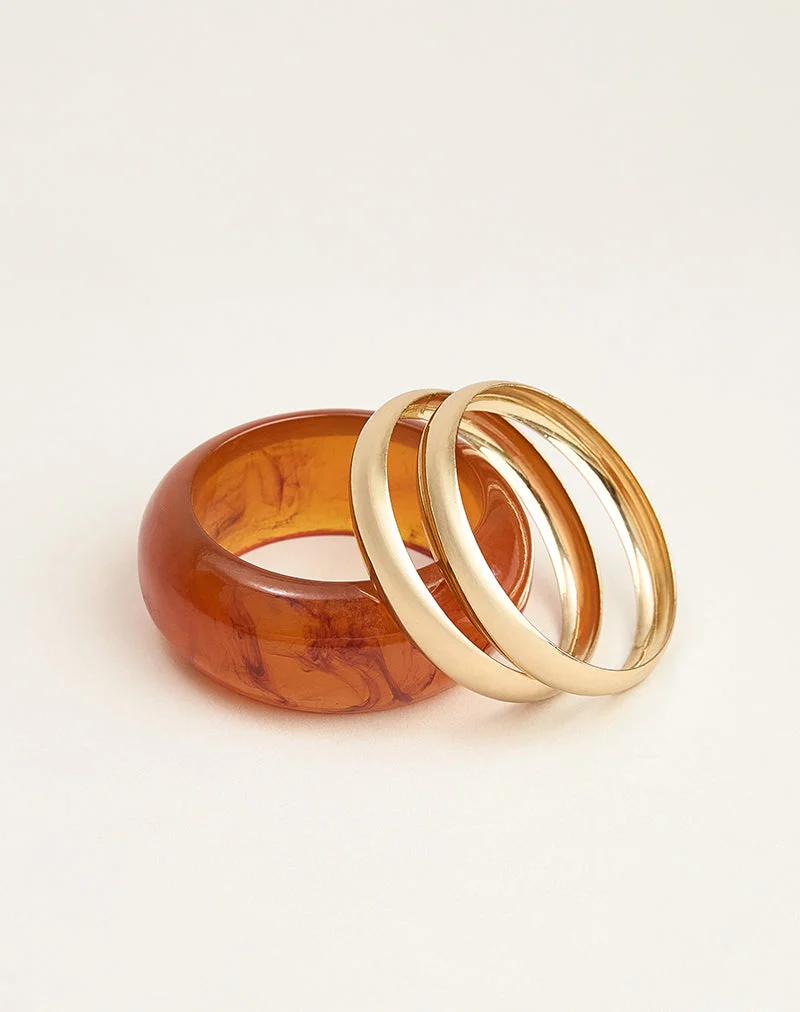 Parure de bracelets orange et dorés