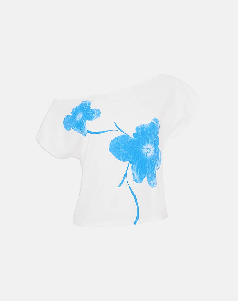 Haut asymétrique à manches courtes Balia, couleur blanc cassé, orné d'une silhouette de fleur bleue