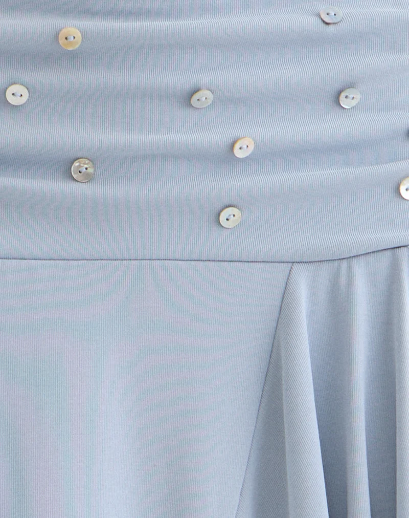 Jupe mi-longue Faliha en lyocell bleu poudré avec boutons en perle
