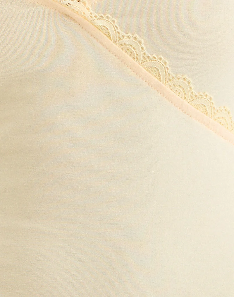 Haut à col en V Sajiwa, couleur « Buttermilk », avec bordure en dentelle