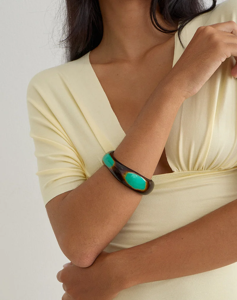 Bracelet rigide en bois noir et turquoise