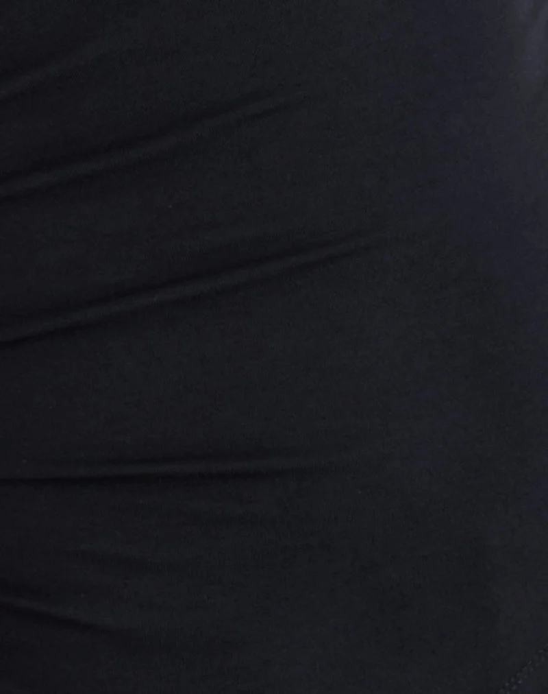 Ishika - Top à col asymétrique et œillets en noir