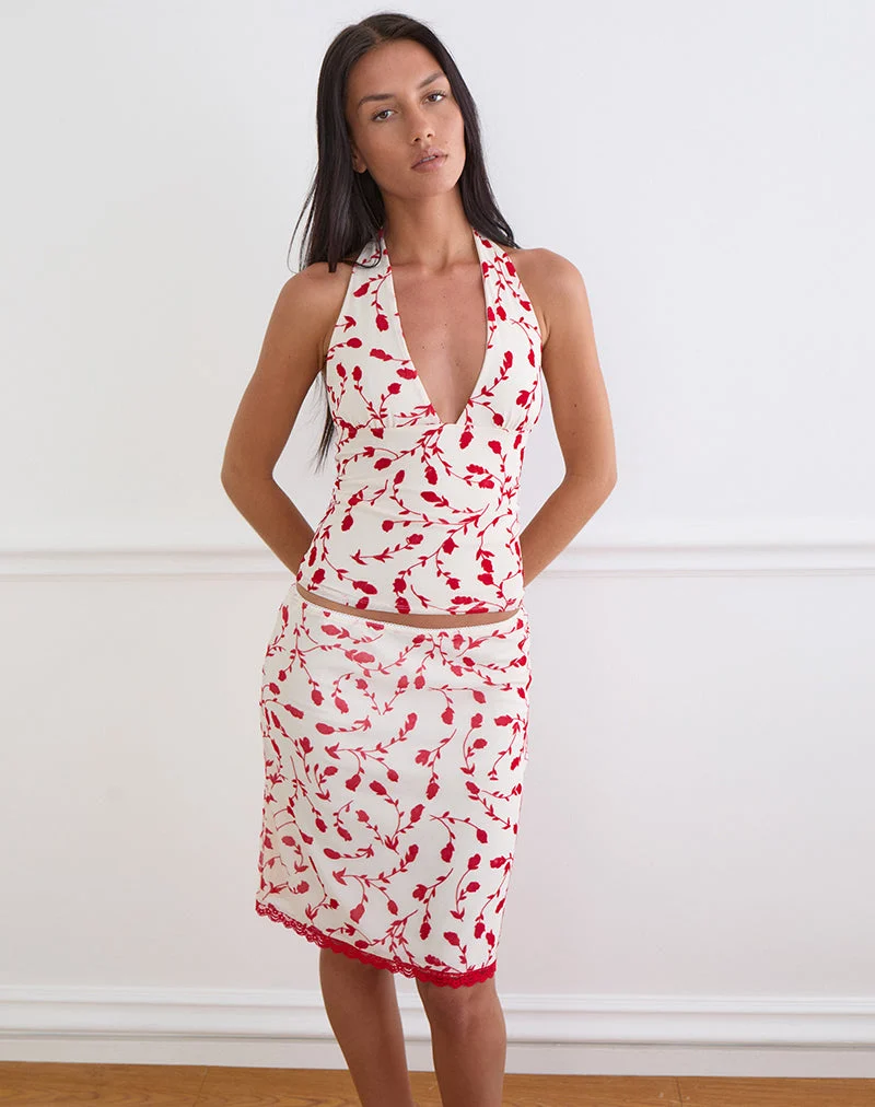 Haut Corsita couleur crème avec motif de lys feuillu rouge en flocage
