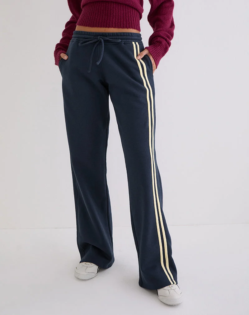Jogging Covero bleu marine avec bordure couleur beurre