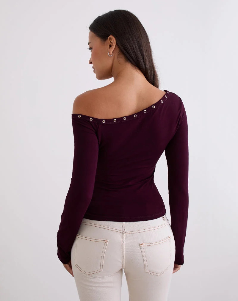 Top asymétrique Noraba en bois rouge avec œillets