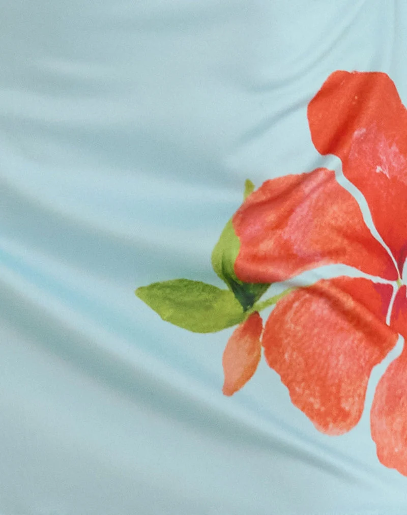 Minijupe Nisrin, bleue avec fleur orange
