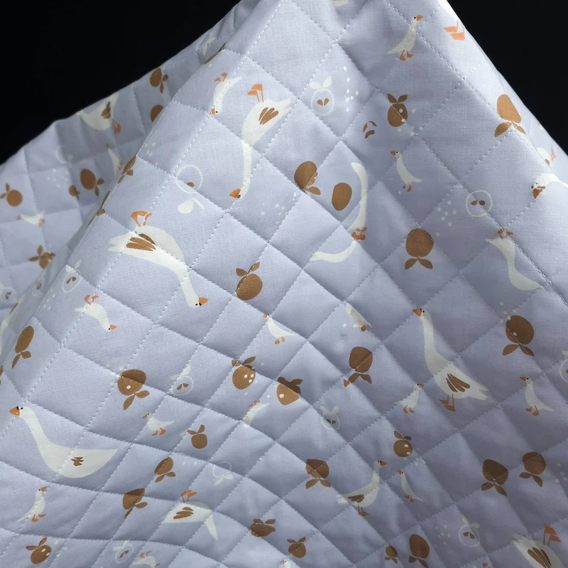 Coton matelassé réversible | Oies bleues & jardin ivoire